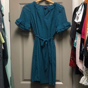 Teal blue dress with feminine details